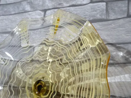 Wandteller in amber/ FOGLIA di Vetro