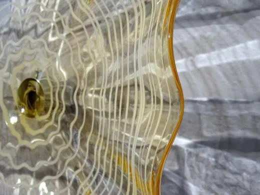 Wandteller in amber/ FOGLIA di Vetro